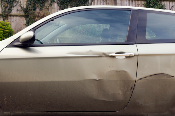 dented car after hit and run accident